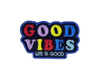 May include: A black embroidered patch with the words "GOOD VIBES" in colorful letters. The words "LIFE IS GOOD" are written in white below the main text.