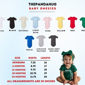 a baby wearing a green shirt and a green headband sitting in front of a