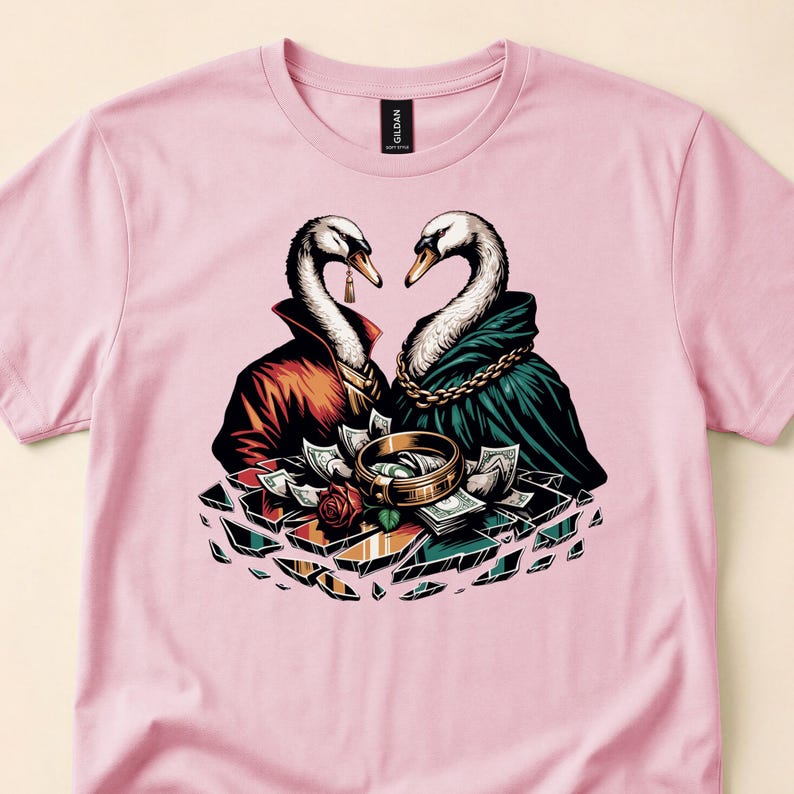 Pink tee close-up, showing two dressed swans facing each other over teacups.