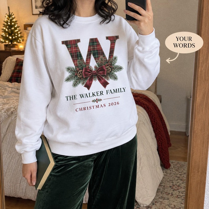 White Walker Family sweatshirt with a tartan W and festive bow.