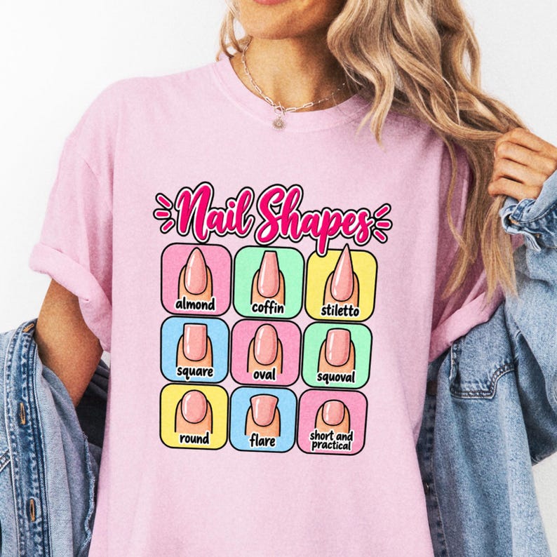 Close view of a pink Nail Shapes tee with nine illustrated nail styles in pastel boxes.
