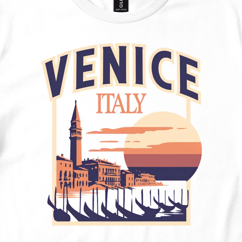 White shirt close-up with Venice Italy text, waterfront buildings and gondolas at sunset.