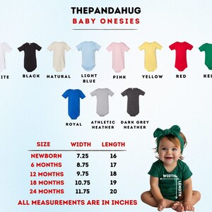 a baby wearing a green shirt and a green headband sitting in front of a