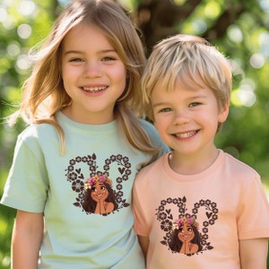 two young children standing next to each other