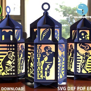May include: Navy blue paper lanterns with football-themed cutouts. Each lantern features silhouettes of football players, helmets, and footballs. The word "FOOTBALL" is displayed on one lantern. The lanterns are designed for digital download.