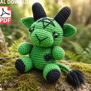 May include: A green crocheted plush toy featuring black horns, black hooves, and a black tail with a tufted end. The creature has large dark eyes and a black pentagram stitched onto its forehead, with a small black patch on its chest. Digital download.