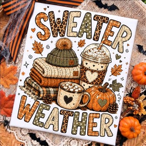 May include: A rectangular sign featuring the text SWEATER WEATHER in large, patterned letters. The design includes a stack of folded sweaters, a beanie with a pom-pom, a coffee cup with a straw, a mug of hot cocoa, and a pumpkin, all decorated with hearts.