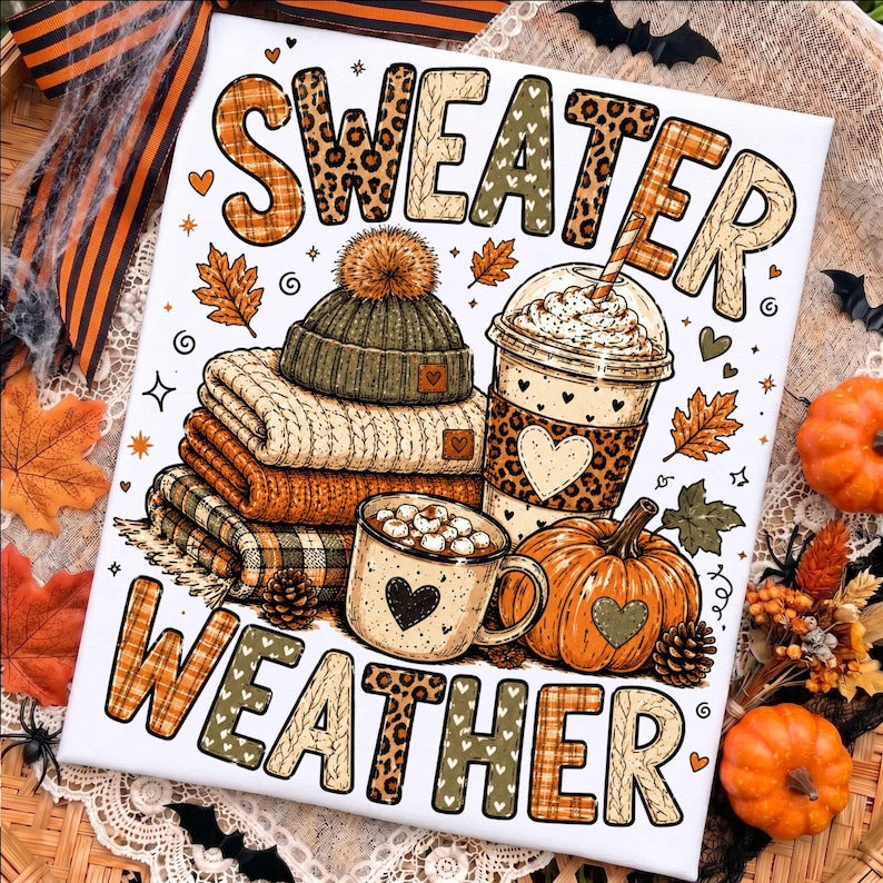 May include: A rectangular sign featuring the text SWEATER WEATHER in large, patterned letters. The design includes a stack of folded sweaters, a beanie with a pom-pom, a coffee cup with a straw, a mug of hot cocoa, and a pumpkin, all decorated with hearts.