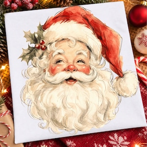 May include: A square white canvas featuring a watercolor illustration of Santa Claus. He wears a red hat with a white pom-pom and has a thick white beard. A sprig of green holly with three red berries is tucked into the side of his hat.