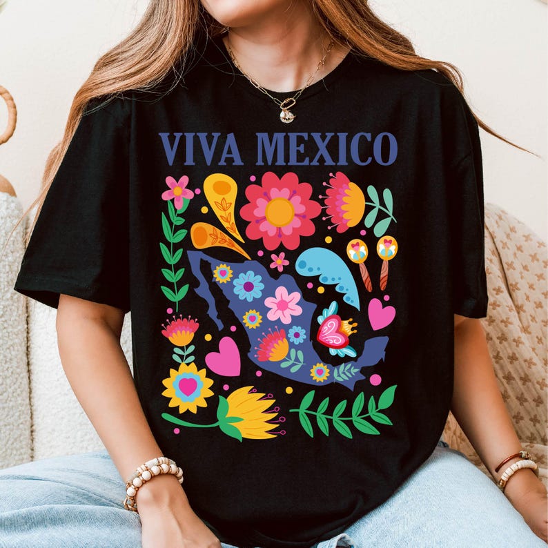 May include: Black t-shirt with a colorful floral design featuring a silhouette of Mexico and the text "Viva Mexico".