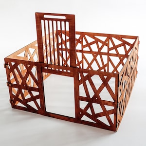 May include: A wooden pet playpen with a geometric design. The playpen has a separate entrance with a gate.