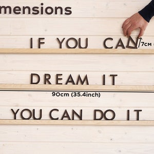 May include: Wooden wall decor with the phrase "IF YOU CAN DREAM IT YOU CAN DO IT" in black letters. The letters are 7cm (2.8 inches) tall and the total length of the decor is 90cm (35.4 inches).