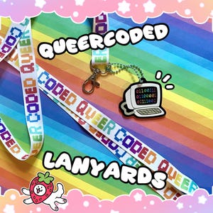 May include: White lanyards with the text "QUEER CODED" in rainbow colors. A computer-shaped charm with binary code hangs from a silver chain. The word "LANYARDS" is written in a playful font. The background is a rainbow gradient.
