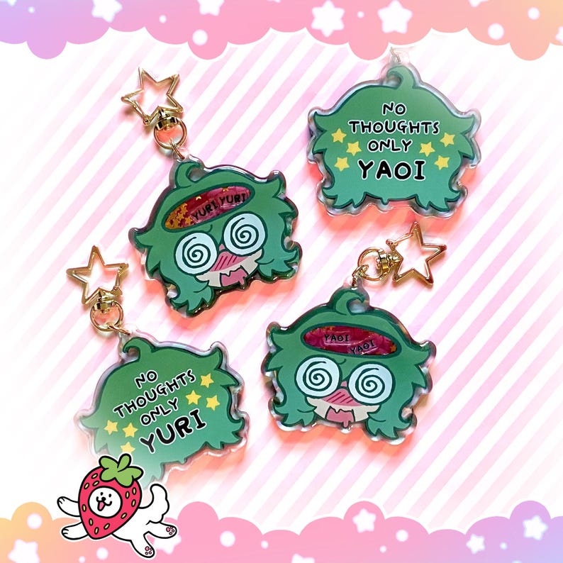 May include: Four green acrylic keychains with cartoon character designs. Each keychain has a gold star-shaped charm and a lobster clasp. The keychains feature the phrases "No Thoughts Only Yuri" and "No Thoughts Only Yaoi".