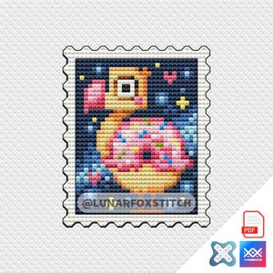 May include: A cross-stitch pattern of a cartoon dodo bird wearing a pink donut with sprinkles. The dodo is in a space-themed background with stars and a heart. The pattern is framed with a postage stamp border and the text "@LUNARFOXSTITCH" is at the bottom.