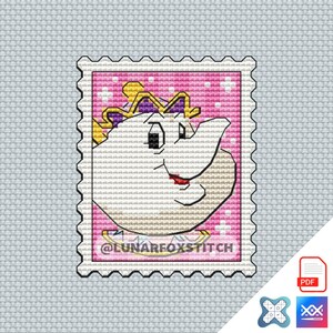 May include: A cross-stitch pattern featuring a white teapot character with a purple and gold crown on a pink background with white sparkles, shaped like a postage stamp with the text @LUNARFOXSTITCH printed in black at the bottom of the design.