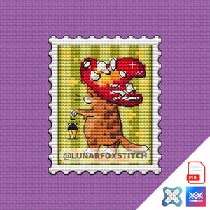 May include: A cross-stitch pattern featuring a cartoon fox wearing a red mushroom hat and holding a cone of ice cream. The pattern is framed in a white border with a green background and the text "@LUNARFOXSTITCH".