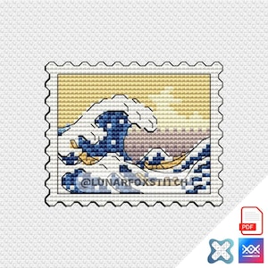 May include: A cross stitch pattern shaped like a postage stamp featuring a stylized blue ocean wave against a beige background. The design includes the text @LUNARFOXSTITCH overlaid on the lower portion of the wave graphic in a dark blue font.