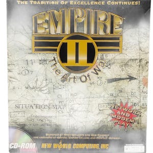 May include: A rectangular video game box for Empire II: The Art of War. The cover features a map background with military symbols, the title in gold and black, and a red starburst graphic stating Network and Modem Play. CD-ROM logo included.