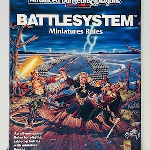 May include: A vintage Advanced Dungeons & Dragons Battlesystem rulebook. The cover depicts a fantasy battle scene with figures wielding weapons. The text reads "Battlesystem Miniatures Rules" and "An all-new game! Rules for playing tabletop battles with miniature figures."