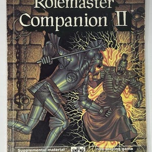 May include: Rolemaster Companion II book cover. The cover shows a fantasy illustration of two armored figures in combat, with the title text at the top. The background is a brick wall with lightning effects.