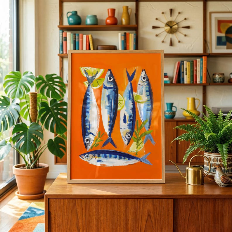 a vibrant orange framed artwork depicting a group of fish, surrounded by various decorative elements such as plants, vases, and books.