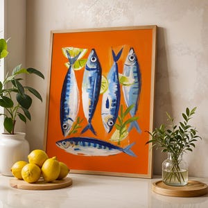a vibrant painting of fish on an orange background, surrounded by various decorative elements such as a vase of green leaves, a bowl of lemons, and a potted plant.