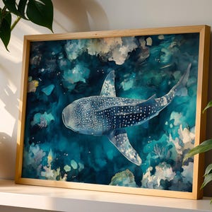 A framed painting depicting a large whale shark swimming in a vibrant underwater scene, surrounded by colorful coral and marine life.