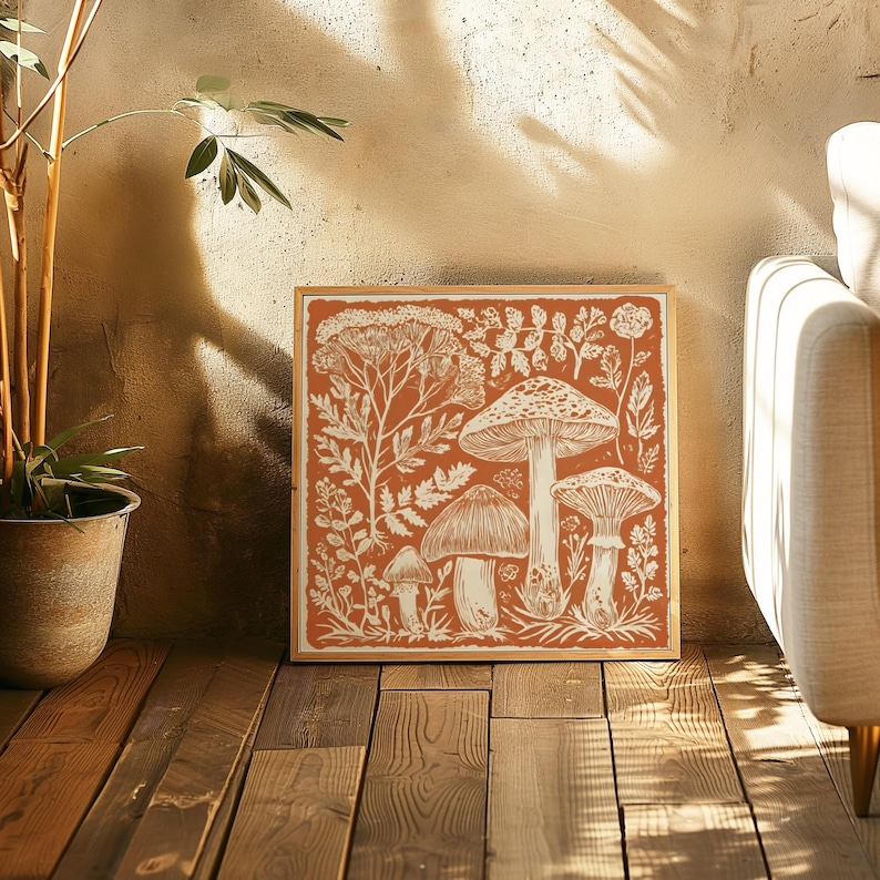 a wooden floor with a framed artwork depicting mushrooms and plants on the wall.