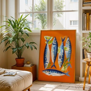 a living room with a large orange painting of fish on the wall, a potted plant, a bookshelf, and a small table with a plant.