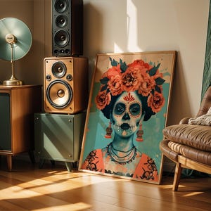 a framed artwork of a woman with a skull-like face, adorned with flowers, displayed in a room with various audio equipment and furniture.
