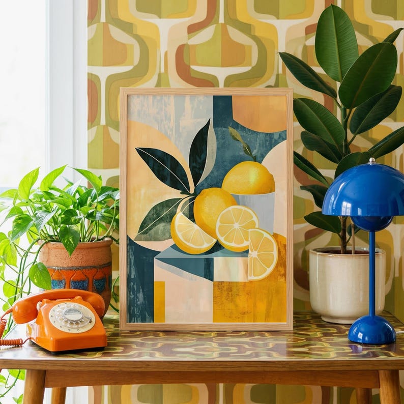 a framed artwork of lemons and oranges on a wooden table, surrounded by potted plants and a vintage-style lamp.