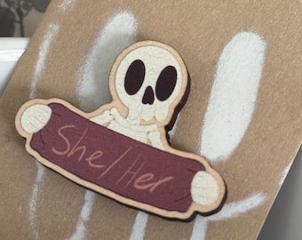She/her pronouns pin badge