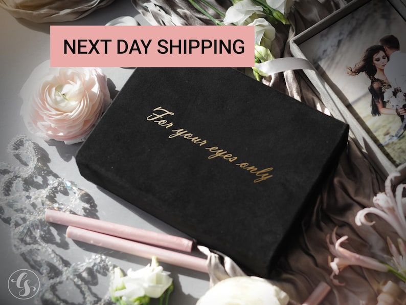 May include: A black box with gold lettering that reads "For your eyes only" is surrounded by flowers and wax sticks. A photo of a couple is visible in the background. The text "NEXT DAY SHIPPING" is in a pink rectangle.