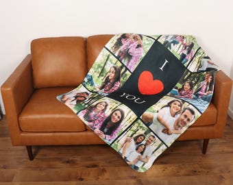 May include: A black and white photo collage fleece throw blanket with a red heart and the text "I love you". The blanket features photos of a family.