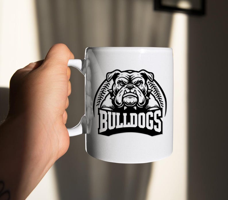 May include: White ceramic mug with a black and white illustration of a bulldog with the text "BULLDOGS" underneath.