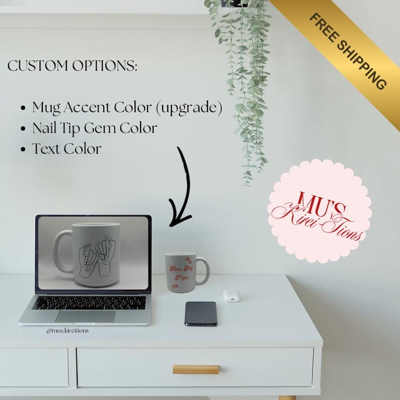 May include: A white desk displays a laptop showing a mug design, a small mug, and a smartphone. The small mug has text and a floral design. The laptop screen shows a mug with a hand design. Text on the wall reads "CUSTOM OPTIONS:" and "FREE SHIPPING."