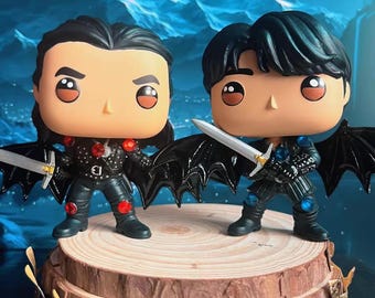 Cassian and Azriel Funko Pop. Note.