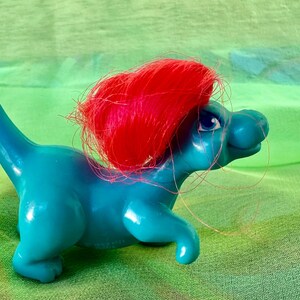 May include: A white ceramic mug with a black handle and the text "But First, Coffee" in a bold, black font. The mug sits on a white surface, showcasing its clean design. Perfect for coffee or tea.