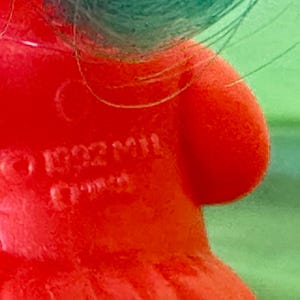 May include: A set of three ceramic vases in varying heights. The vases have a matte finish in shades of cream, beige, and brown. The tallest vase is approximately 10 inches high.