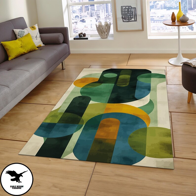 May include: Abstract area rug with geometric shapes in shades of green, blue, and yellow on a cream background.