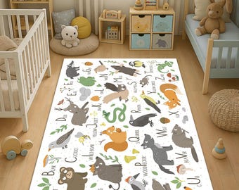 May include: A white rectangular rug with an animal alphabet design. Each letter features a different animal illustration, including a bear, fox, and snake. The rug is designed for a child's room.
