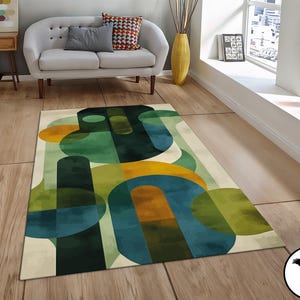 May include: Abstract area rug with a geometric design featuring overlapping circles in shades of green, blue, and yellow on a cream background.