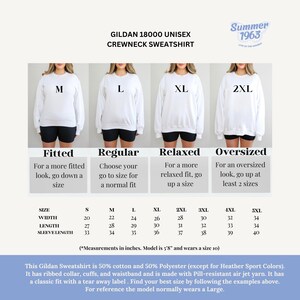 May include: A size chart for a Gildan 18000 unisex crewneck sweatshirt. The chart shows the different sizes available, from S to 5XL, and the corresponding measurements in inches for width, length, and sleeve length. The chart also includes a description of the fit for each size: fitted, regular, relaxed, and oversized.