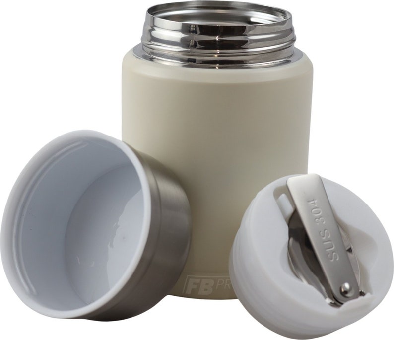 May include: A cream-colored stainless steel water bottle with a silver rim and a white interior. The bottle is shown with its lid and cap removed, revealing the interior. The cap has a stainless steel hinge and the text "SUS 304".