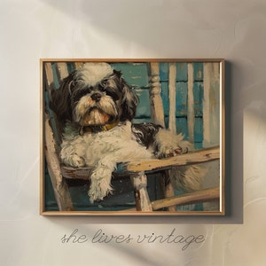 May include: A framed painting of a black and white dog sitting in a wooden rocking chair. The dog is looking directly at the viewer. The background is a blue and white painted wall.