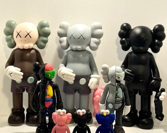 KAWS -  Kaws Figures, Holding Sesame Street statue, 11.8in