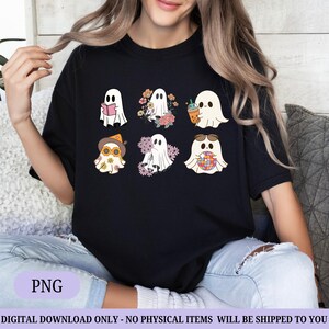 May include: Black t-shirt featuring six cartoon ghosts with various accessories, including a book, flowers, a drink, sunglasses, a hat, and a globe. The shirt has the text "PNG" at the bottom.