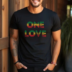 May include: A black t-shirt with the words "ONE LOVE" printed in green, yellow, and red.