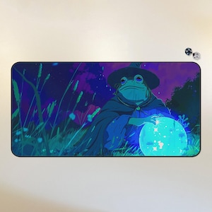 May include: A blue frog wearing a pointed hat and a dark robe holds a glowing blue orb in a dark forest setting with a starry sky.